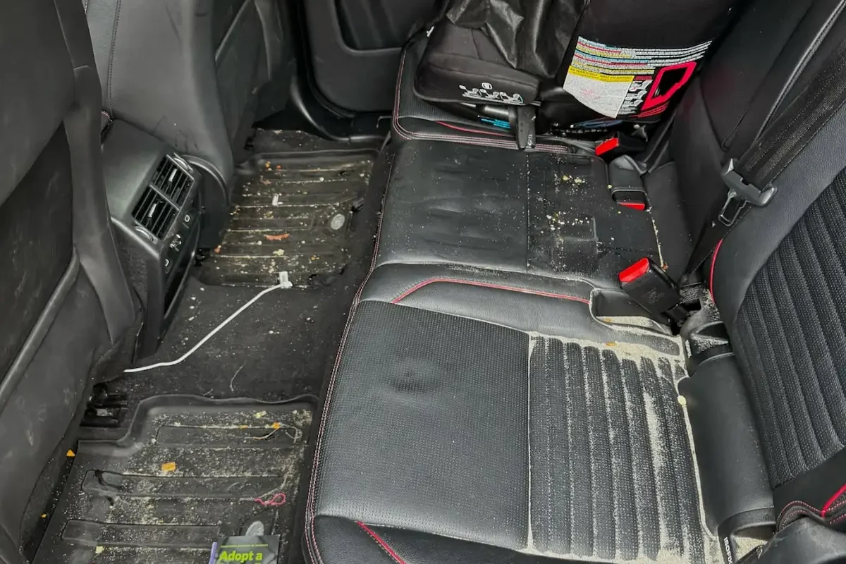 Dirty car seats and carpets before interior detailing in Richmond, CA