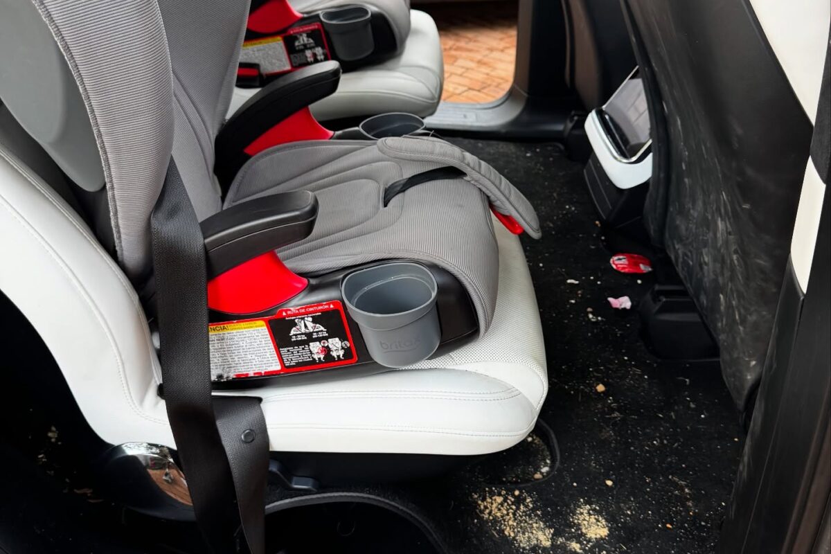 Car interior showing stains and debris before detailing in Richmond, CA